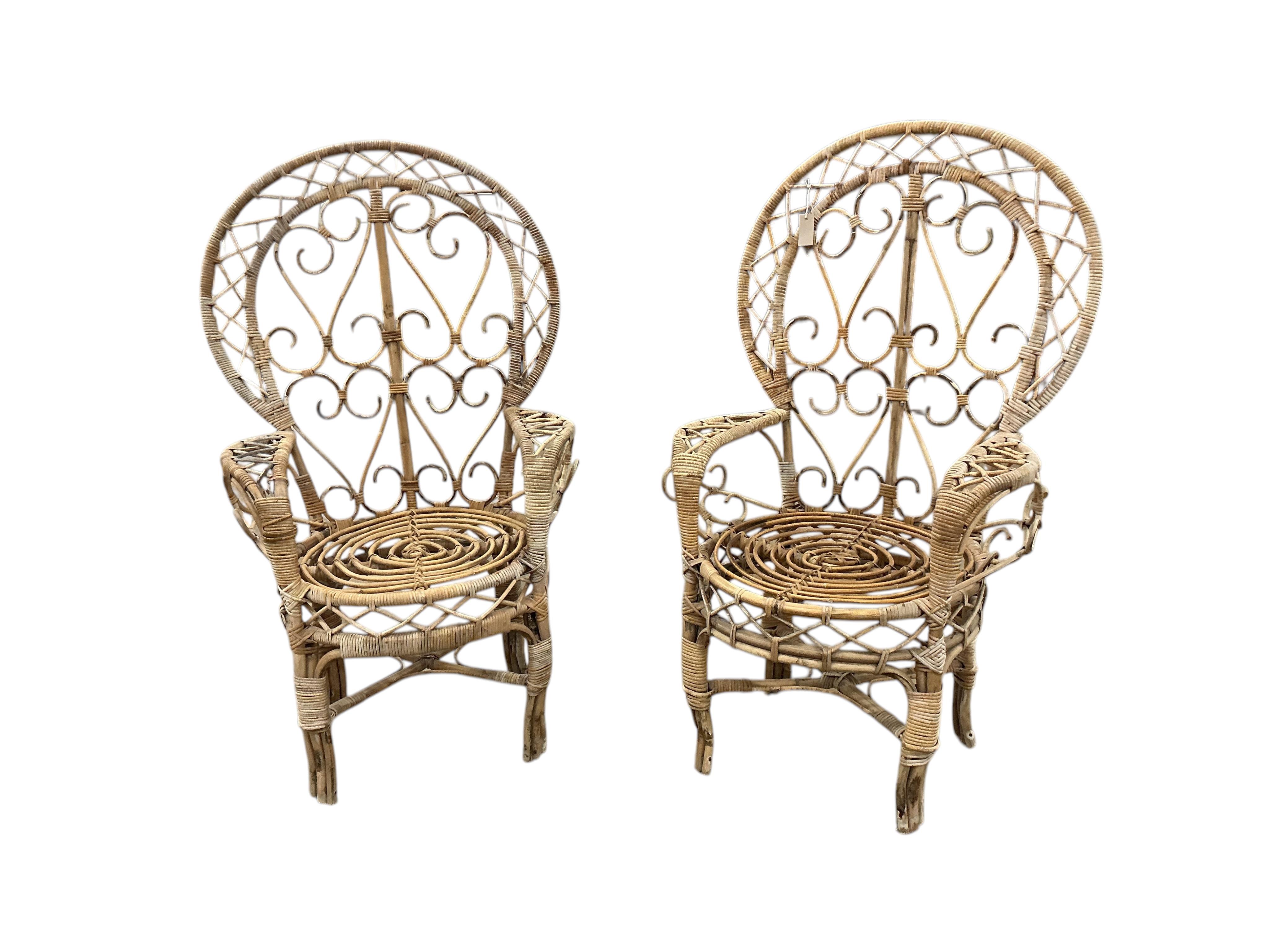 A pair of mid century caned bamboo peacock chairs, width 80cm, depth 56cm, height 134cm